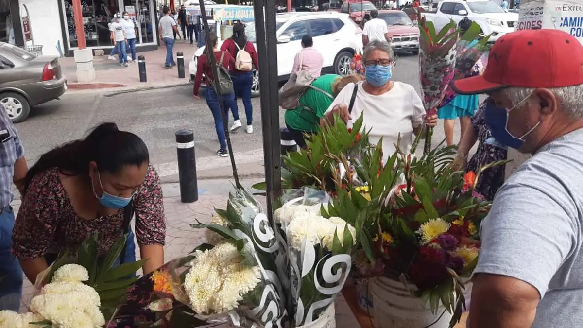 Buscan flores para difuntos