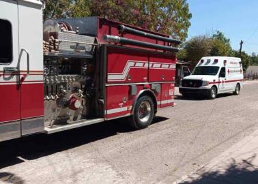 Rescatan a mujer de casa en llamas