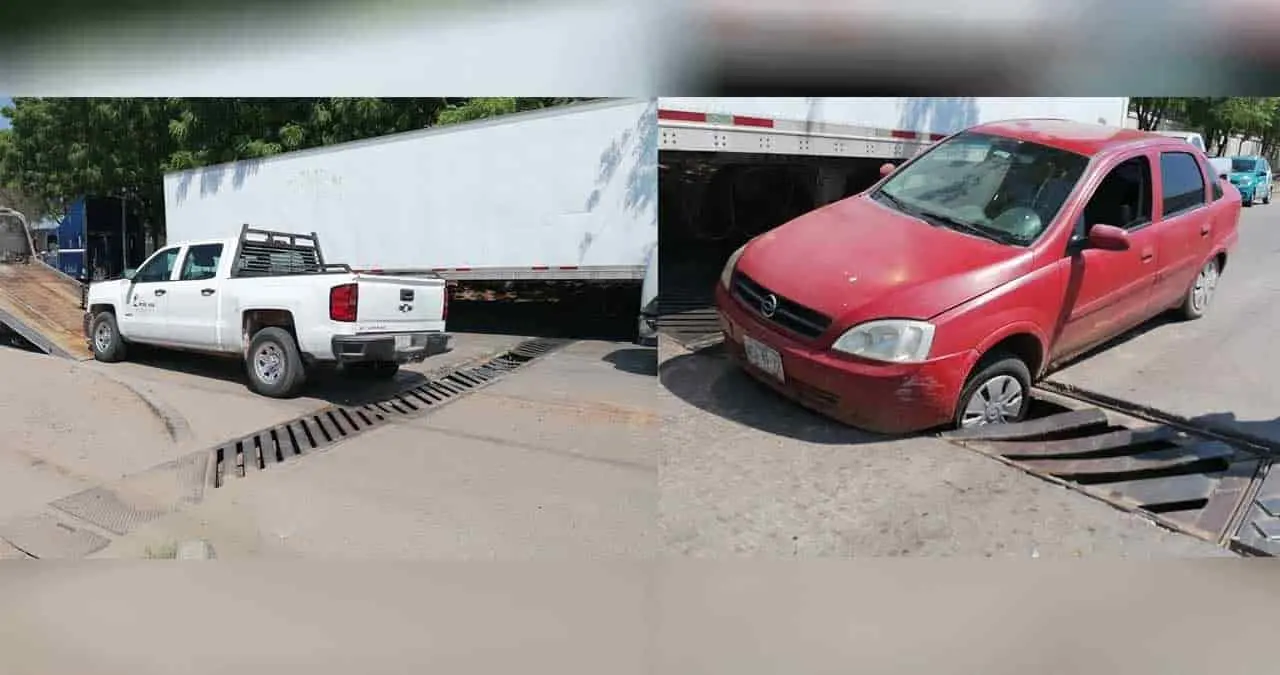 Causa alcantarilla daños en dos vehículos