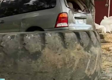 Muere hombre al caerle una llanta mientras lavaba su auto