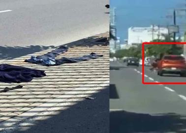 VIDEO. Graban a hombre desnudo colgado de camioneta