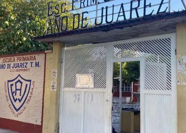 Menor lleva una pistola en la escuela y dispara en el salón