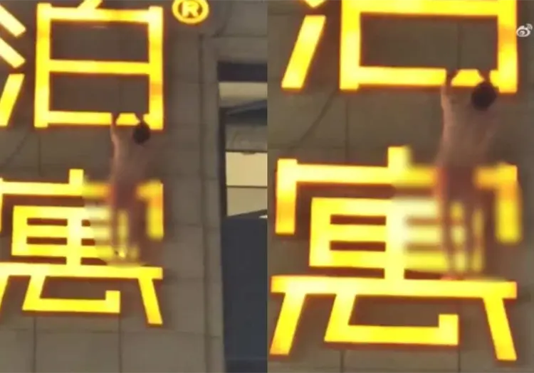 VIDEO | &iexcl;Misi&oacute;n imposible! Infiel queda colgado de un letrero mientras intenta escapar