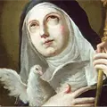 Santoral de hoy, 10 de febrero: Santa Escol&aacute;stica, patrona de las monjas, representada por una paloma